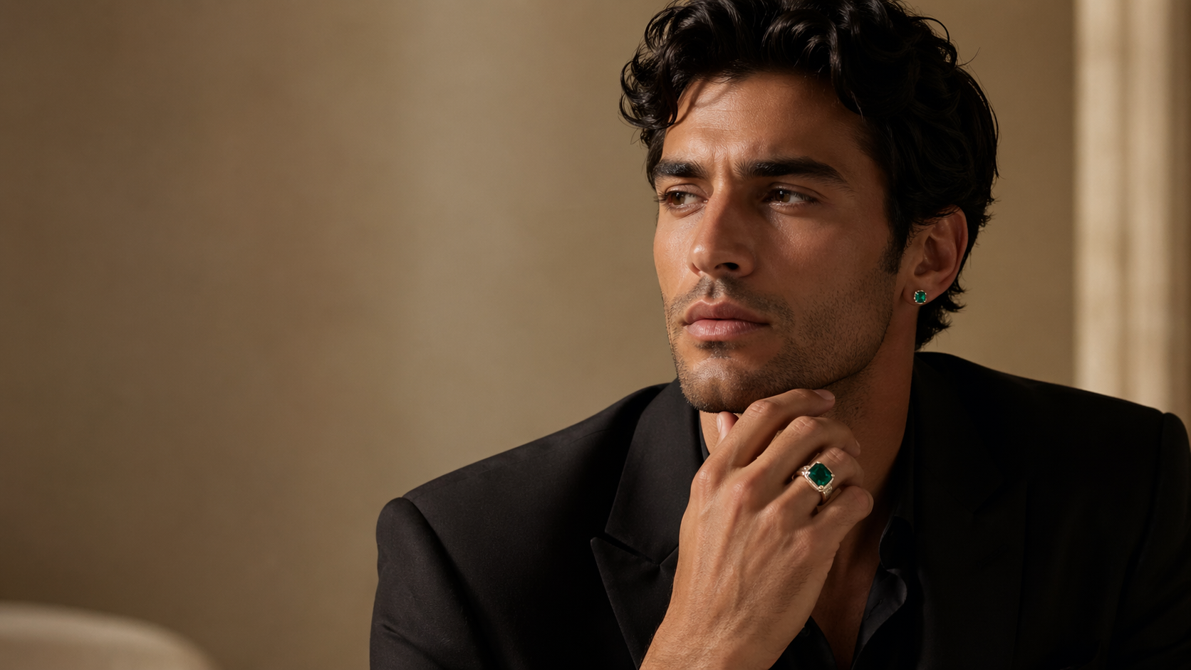 Luxury male portrait wearing emerald jewelry